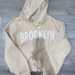 Cream Garage tied waist hoodie